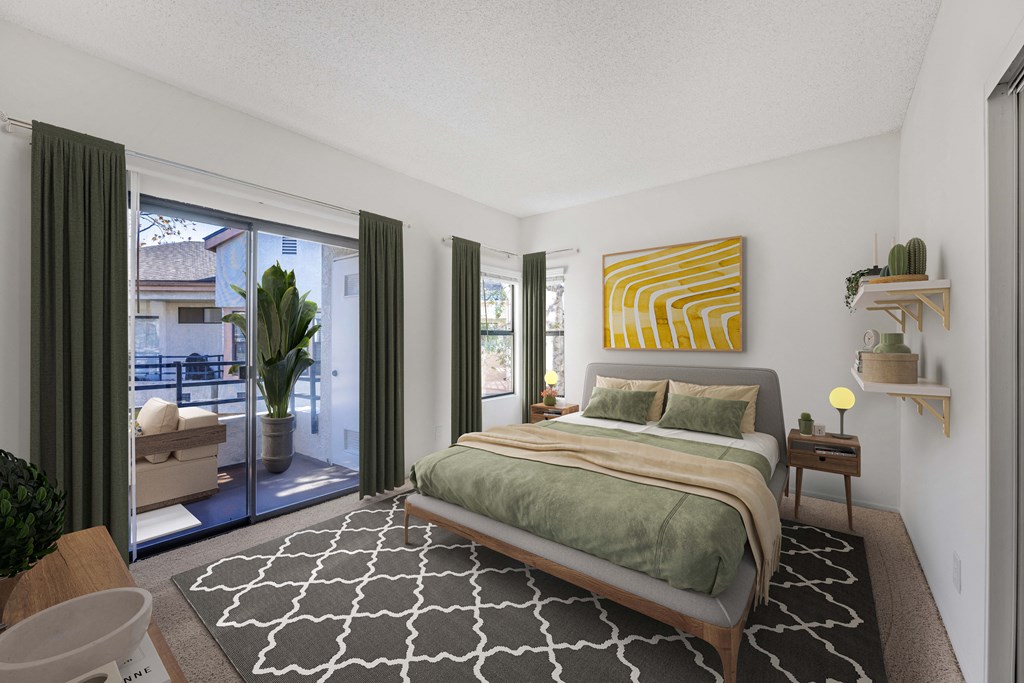 A bedroom with a large bed and a view of the outside.