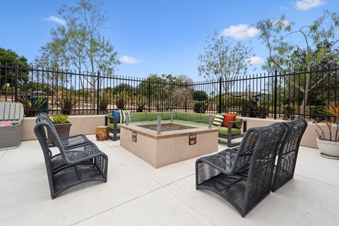 Two black chairs are placed on a patio.