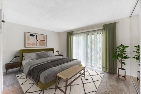 Goleta, CA Apartments Near UCSB - Encina Meadows - Spacious Bedroom with Carpeted Flooring, Large Bed, Footboard Bench, Wooden Nightstands with Lamps, Houseplant, White Walls, and Large Window with Green Curtains.