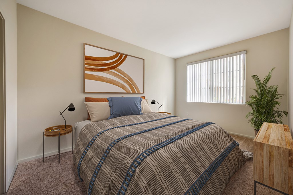 2-Bedroom Apartments in Santa Maria, CA - Hancock Terrace - Bedroom with Plush Carpeting, Large Window with Blinds, Queen Size Bed, Nightstands with Lamps, and Dresser.