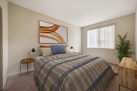a bedroom with a bed and a window