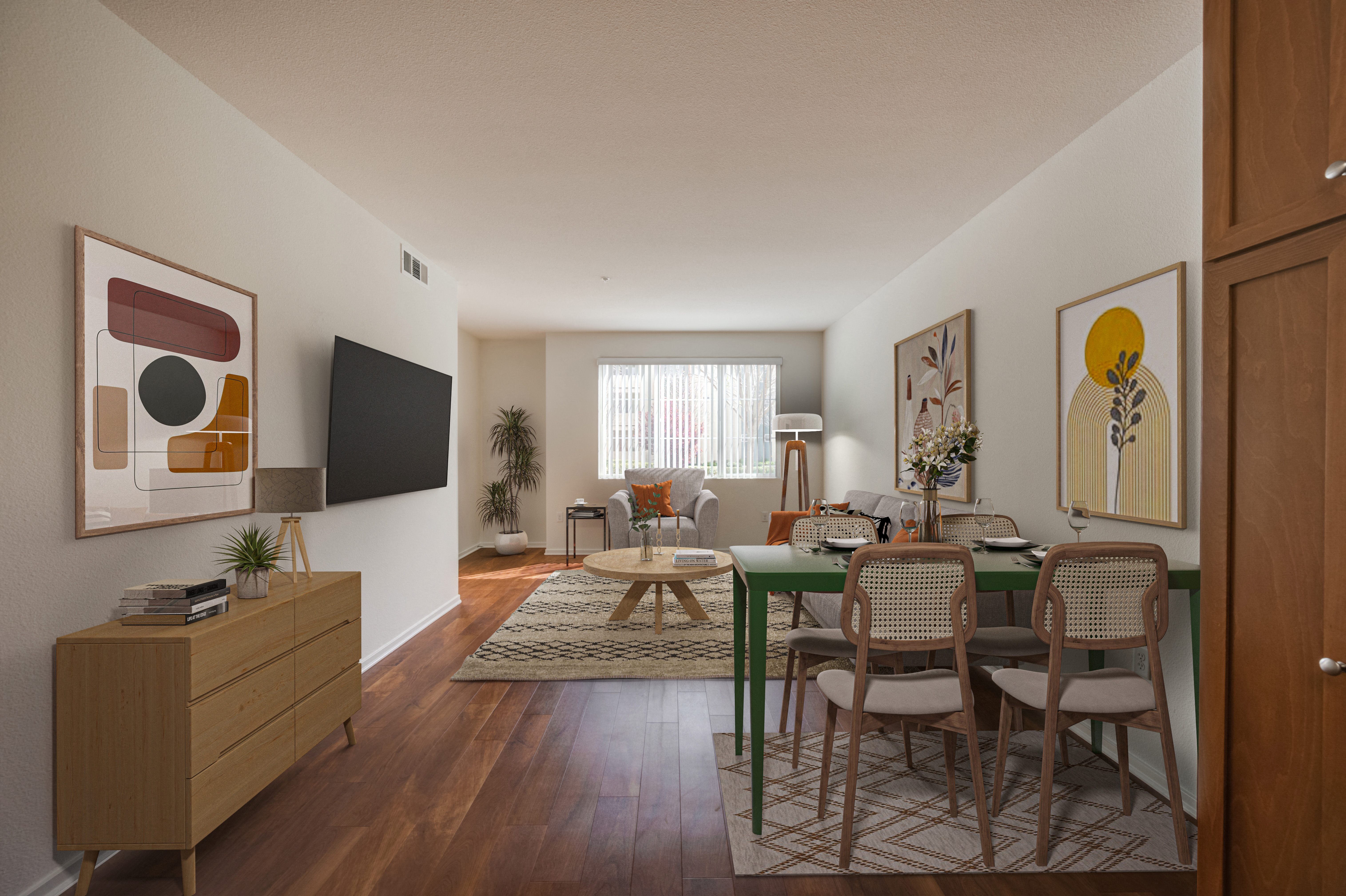 a living room and dining room with a table and chairs