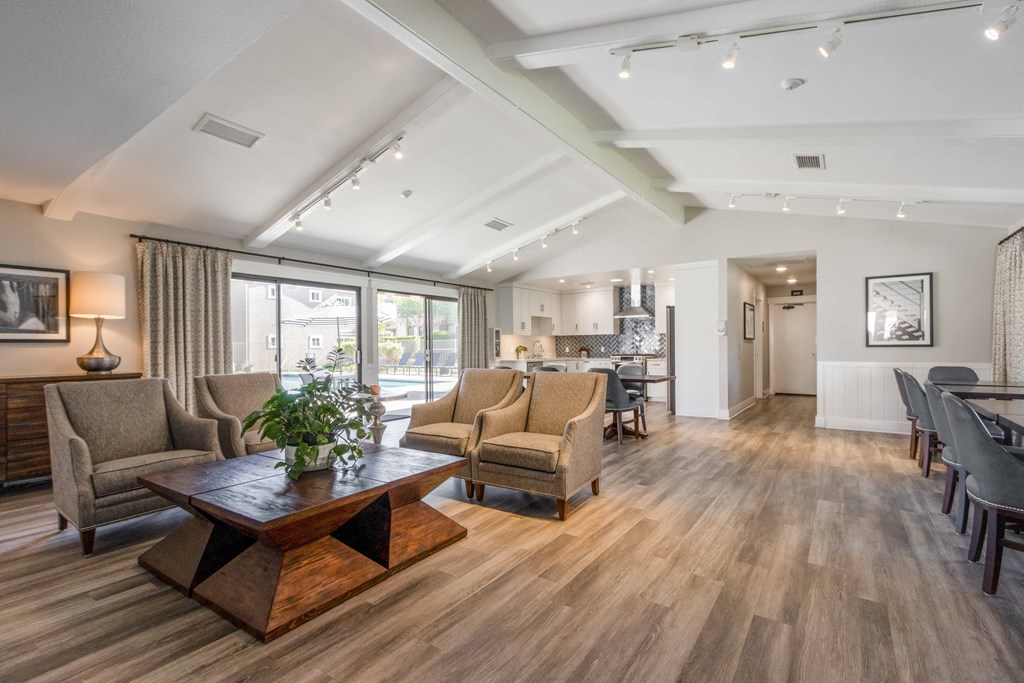 a living room with couches and chairs and a table
