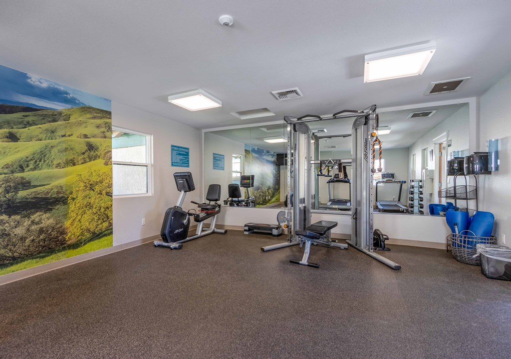 1-BR Apartments In Orcutt, CA - Knollwood Meadows - Fitness Center Equipped With A Cardio Machine, Strength Training Machine, Yoga Mats, Workout Bench, And Full-Body Mirror