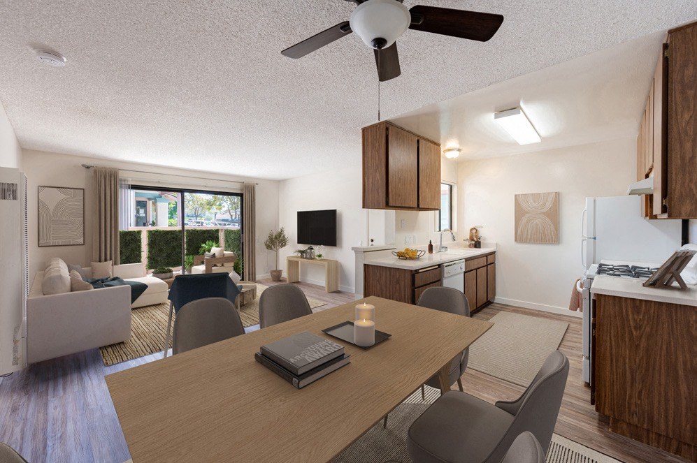 Santa Maria, CA Apartments Near Walmart - Knollwood Meadows - Dining Area With Wood-Style Flooring, Table And Chairs, Ceiling Fan, And View Of Living Room And Kitchen.