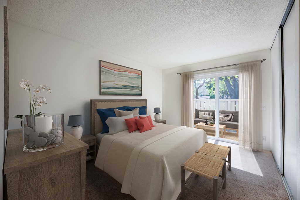 A bedroom with a bed, nightstand, and a painting on the wall.