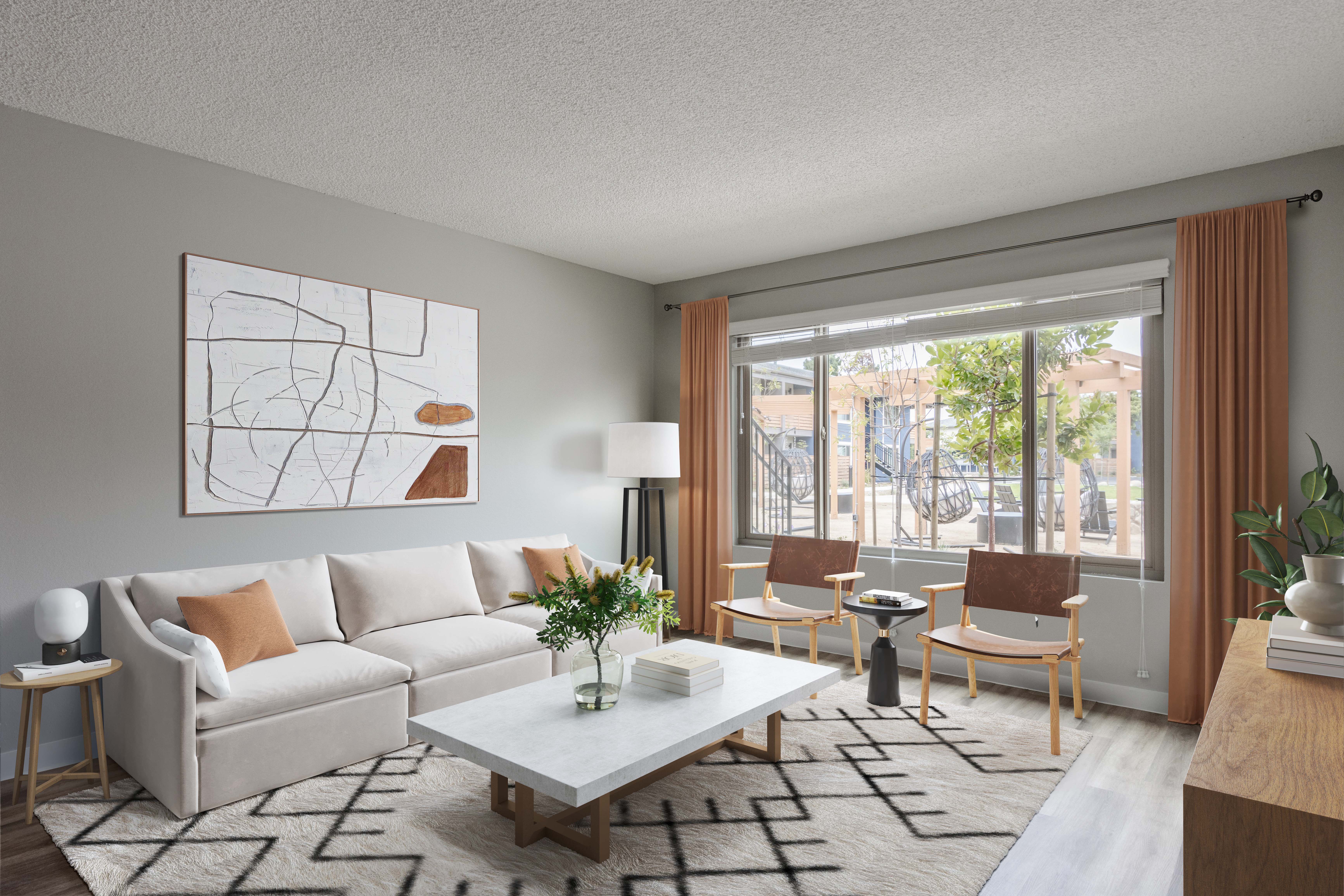 a living room with a white couch and a table