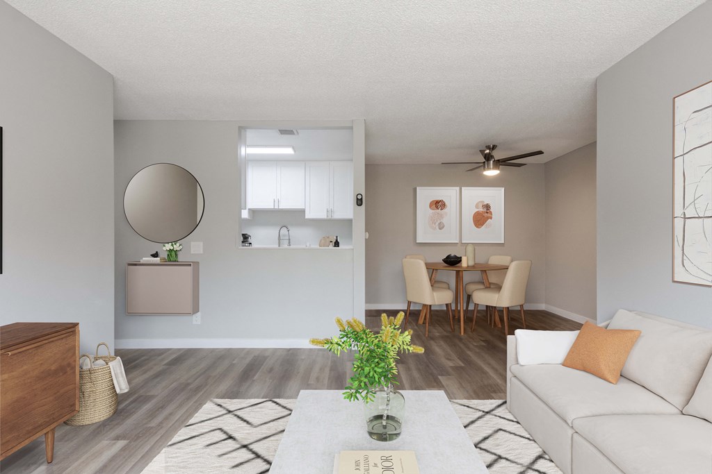 an open living room and dining room with a couch and a table