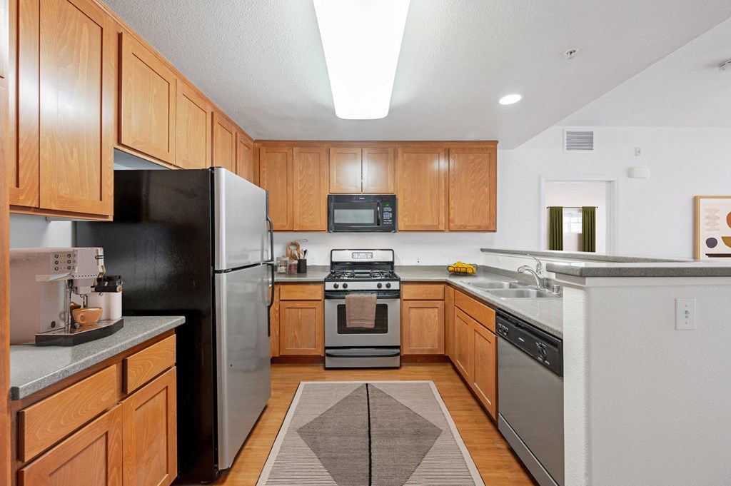 Apartments for Rent in Ventura, CA - Ralston Courtyards - Kitchen with Custom Wood Cabinets and Dishwasher