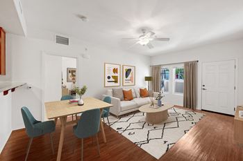 a living room and dining room with a couch and a table