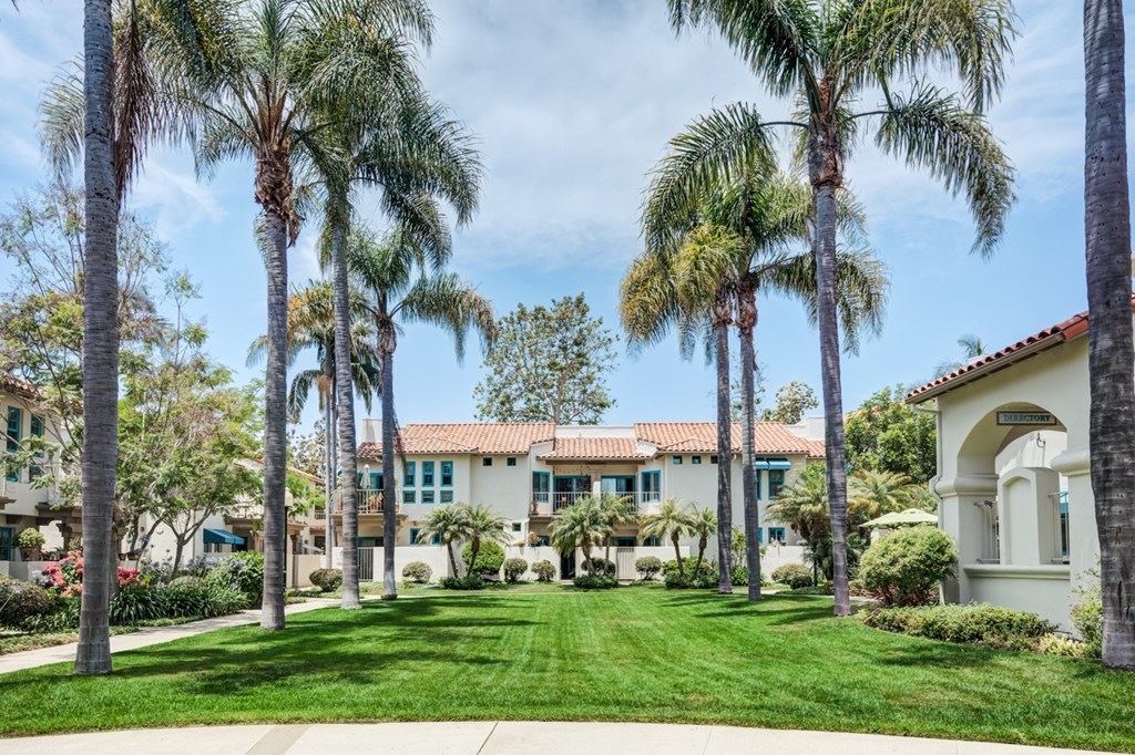 a house with palm trees in front of it