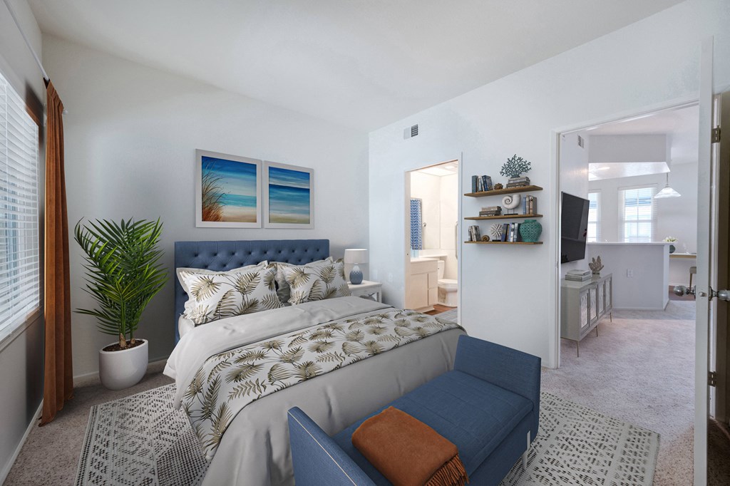 a bedroom with a bed and a couch in a 555 waverly unit