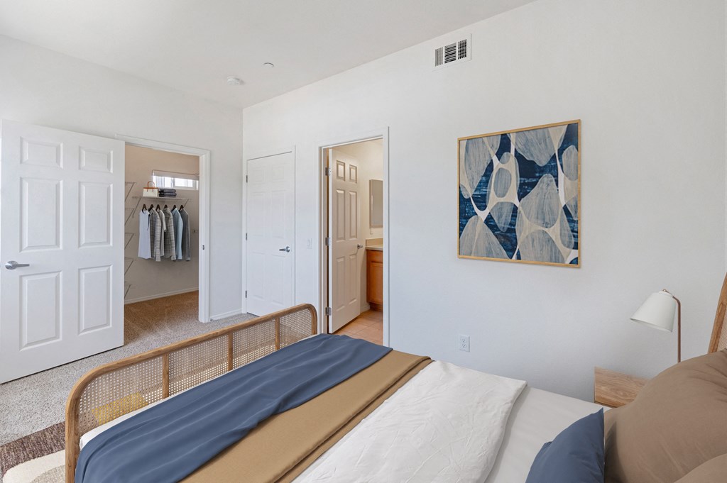 a bedroom with a bed and a closet