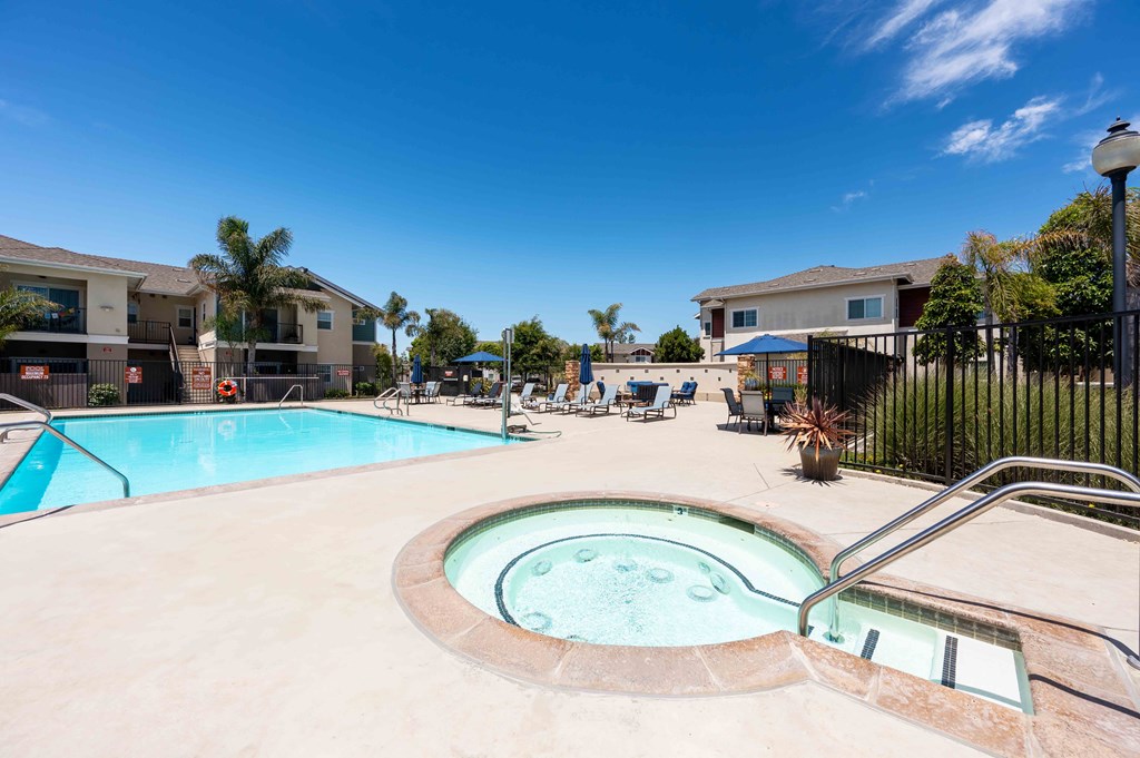 Santa Maria, CA, Apartments Near Vandenberg Air Force Base - Siena - Gated Pool with Hot Tub, Lounge Seats, Tables, Chairs, and Umbrellas