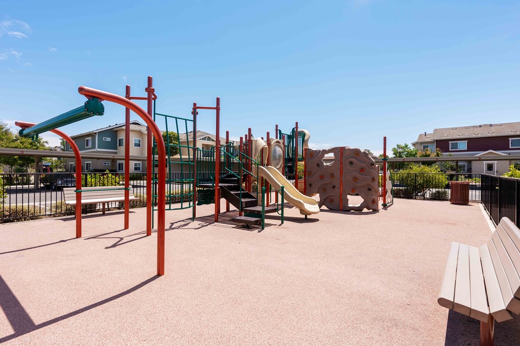 Santa Maria, CA, Apartments Near Walmart - Siena - Gated Playground with Slides, Climbing Structures, and Benches