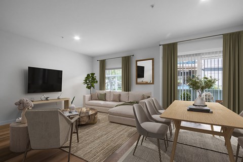 a living room with a couch and a table and a tv