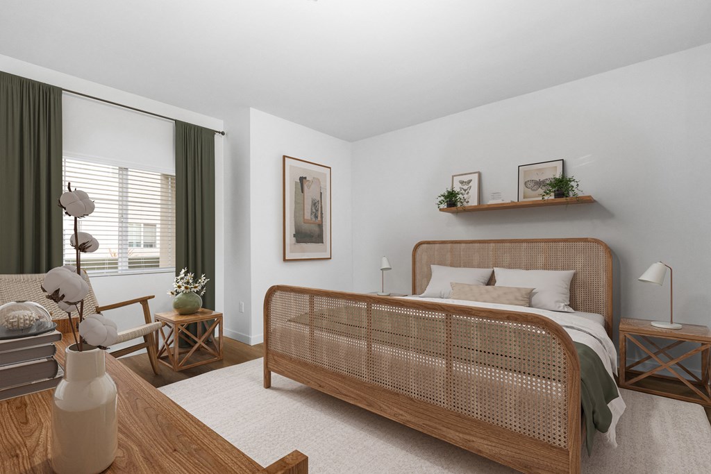 a bedroom with a bed and a large window