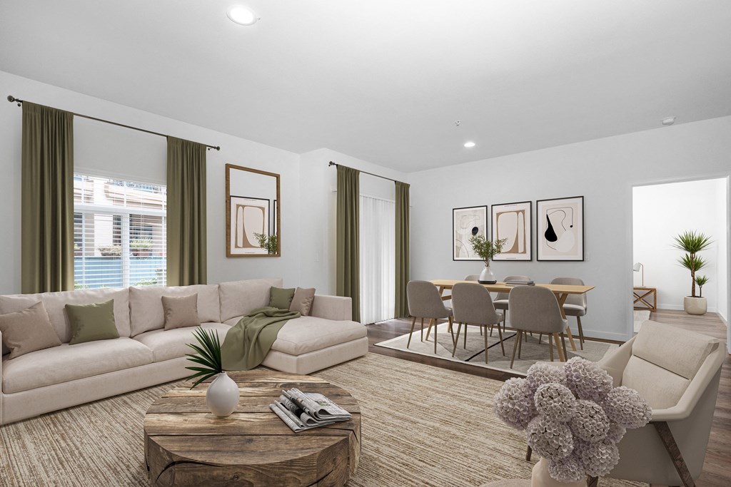 One-Bedroom Apartments in Goleta, CA - Willow Springs - Living Room with Wood-Style Flooring, Area Rug, Sectional Couch, Armchair, Coffee Table, Large Window with Curtains, and View of Dining Area