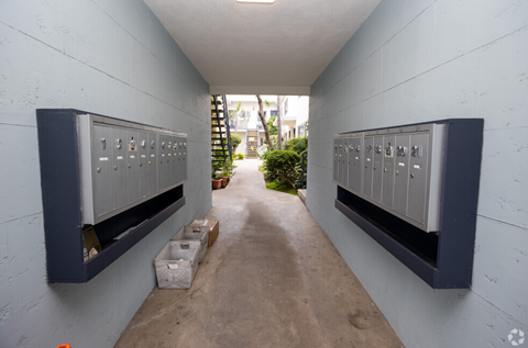a long hallway with lockers on the side of a building