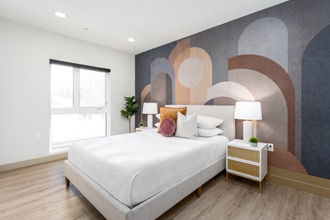 Modern bedroom with geometric wall mural at Lido - 1532 Brockton Ave Apartments, Los Angeles, 90025