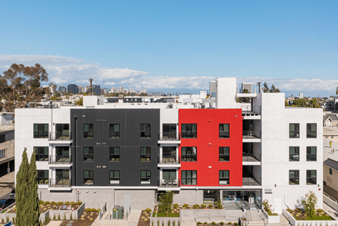 Contemporary apartment building with colorful exterior panels at Lido - 1532 Brockton Ave Apartments, Los Angeles