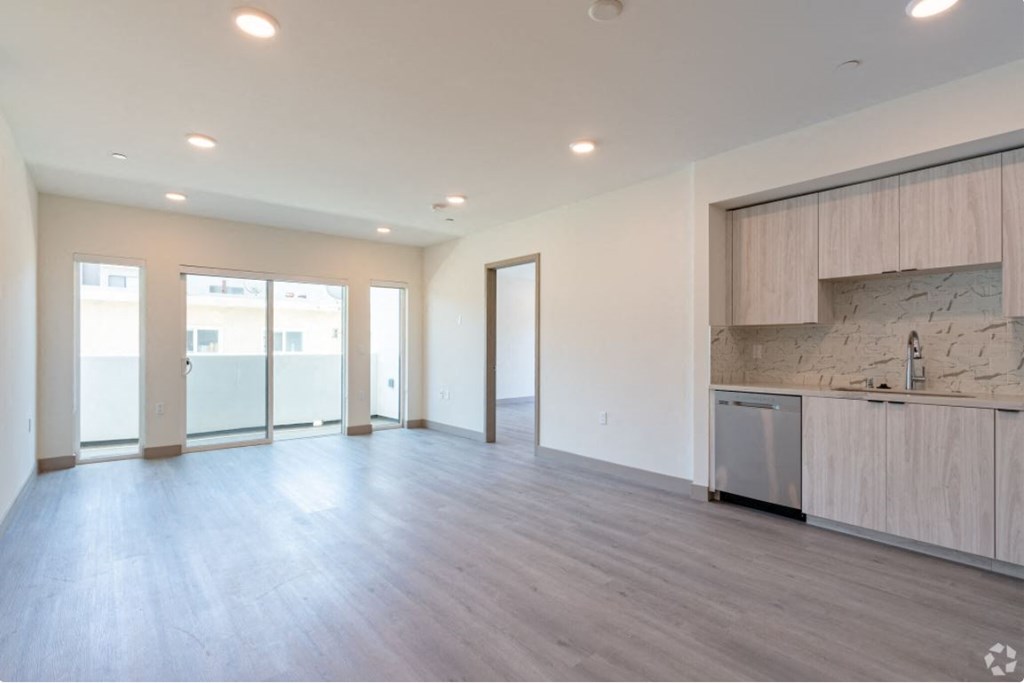 the living room and kitchen in a new home