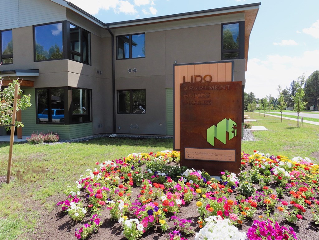 A building with a sign that says LIDO in front of it.