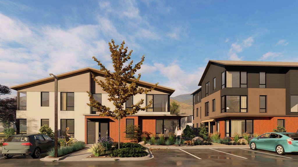 a rendering of two story townhomes with a tree in the middle of a parking lot a rendering of two story townhomes with a tree in the middle of a parking lot at Lido Apartment Homes @ Hailey, ID, Hailey, ID 83333