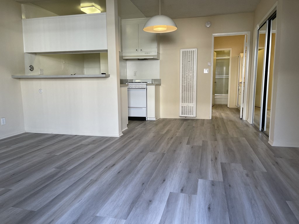 A room with a grey floor and a white wall.