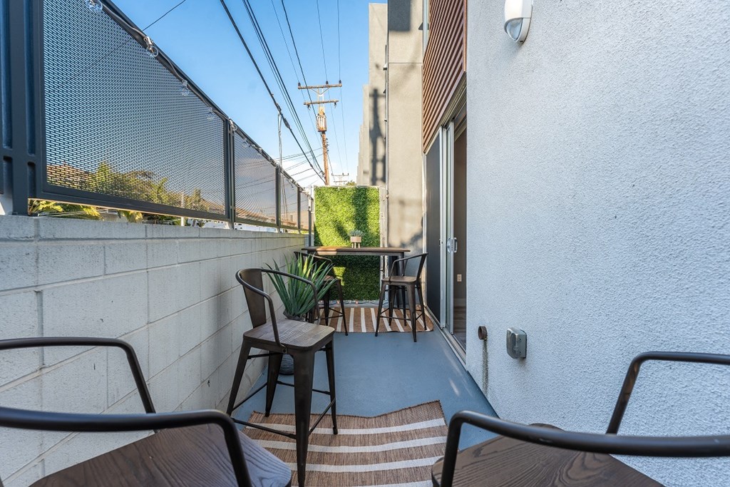 a balcony or terrace with chairs and a table at Lido Apartments - 4025 Grandview, California