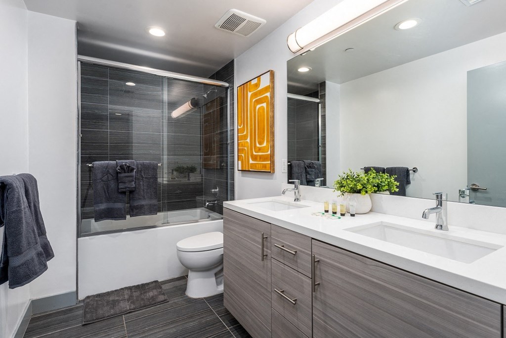 a bathroom with a toilet sink and shower at Lido Apartments - 4025 Grandview, Culver City, California