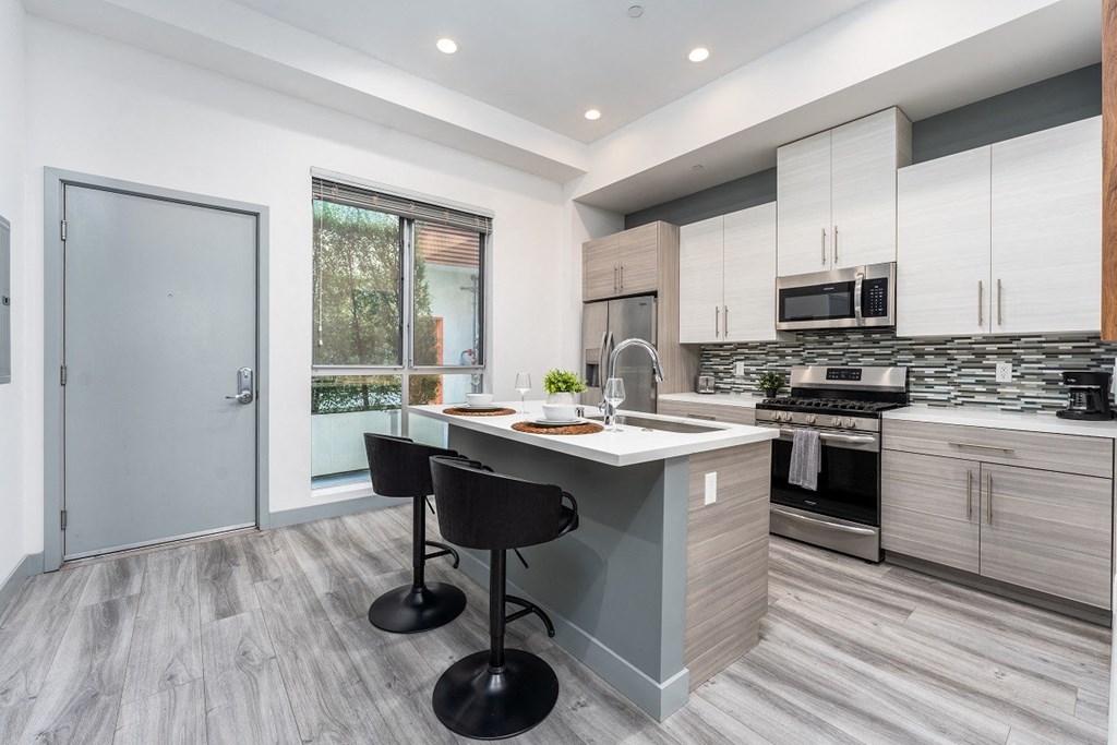 a kitchen with a counter top and a sink at Lido Apartments - 4025 Grandview, Culver City, CA