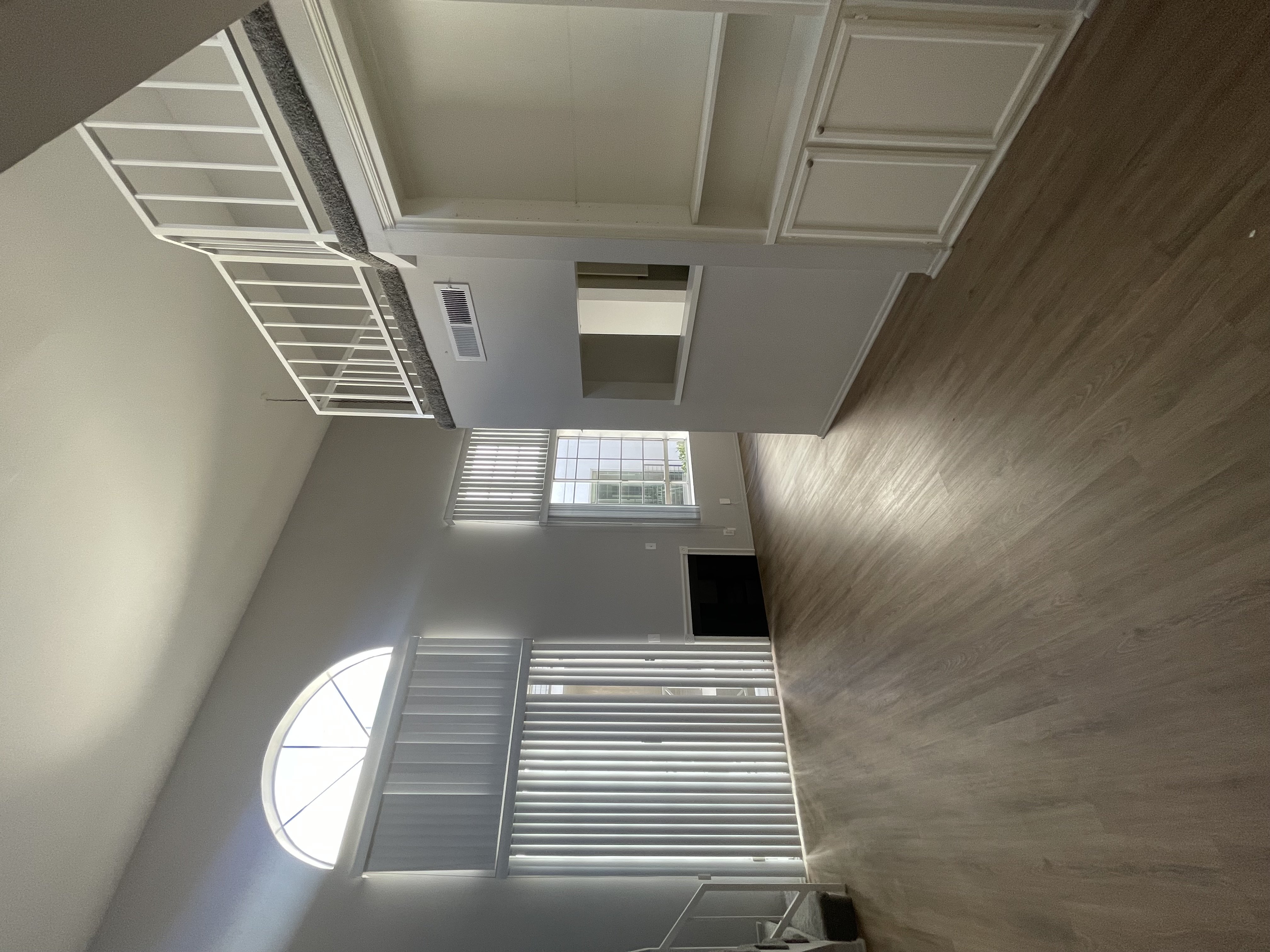 A modern interior with a staircase and a skylight.