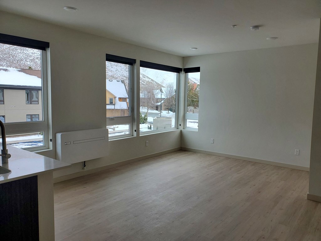 empty living room with corner windows at Lido Apartment Homes @ Hailey, ID, Hailey, ID 83333