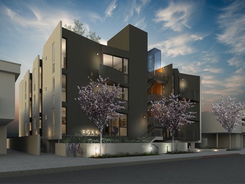 A modern building with a bicycle parked in front.