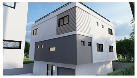 A modern house with a white and grey exterior and a sloped roof.