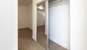 Polo Villas Loft Closet with mirrored sliding doors - Photo Gallery 13