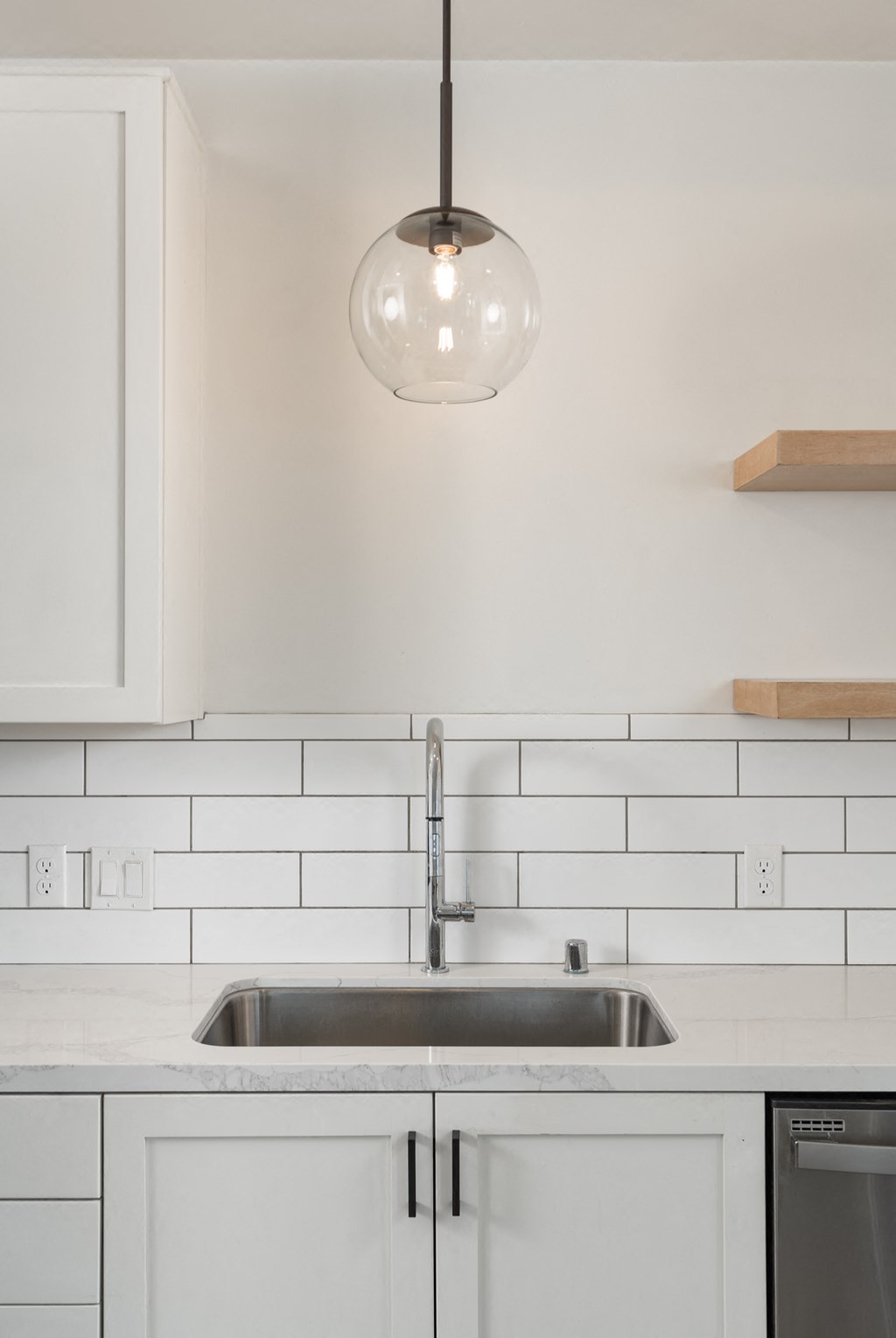 Kitchen sink with hanging pendant  at Plaza Riviera, California, 93103