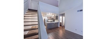 a kitchen and stairs in a 555 waverly unit at Villa Mondavi, California