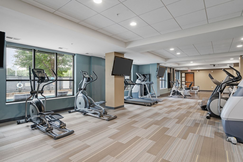 the gym with treadmills and weights at the preserve at greatstone