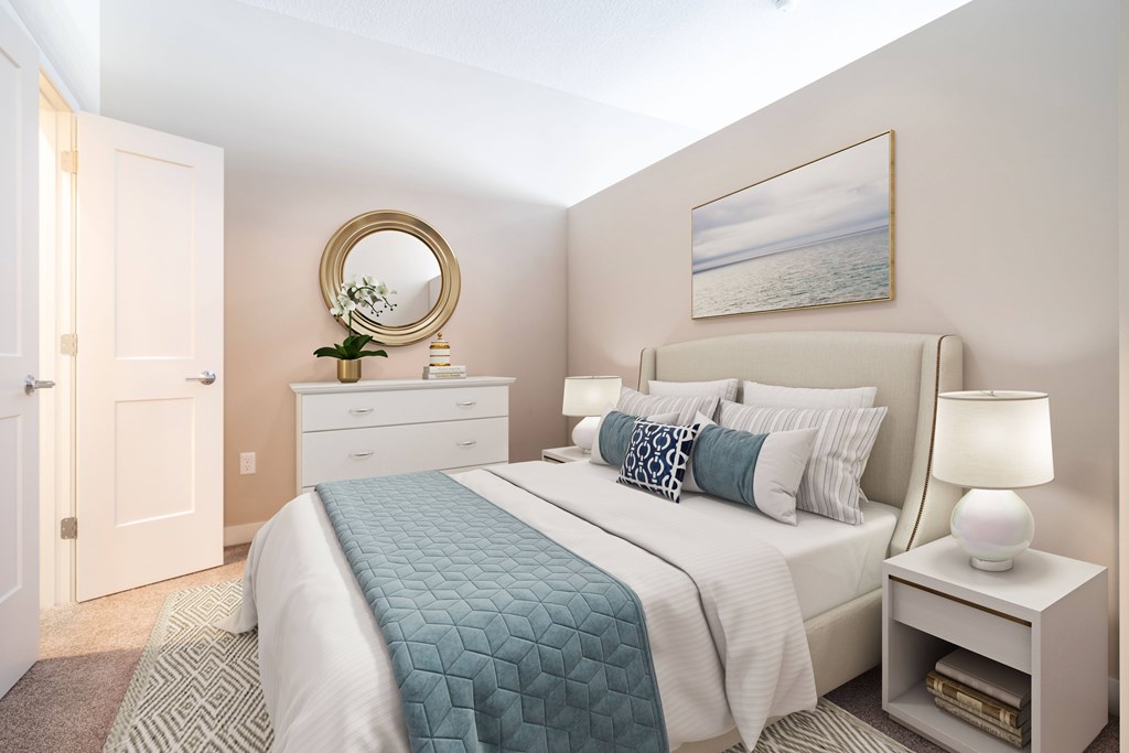 A bedroom with a bed, nightstand, and a painting on the wall.