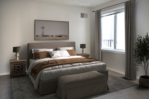 A bedroom with a large bed and a painting on the wall.