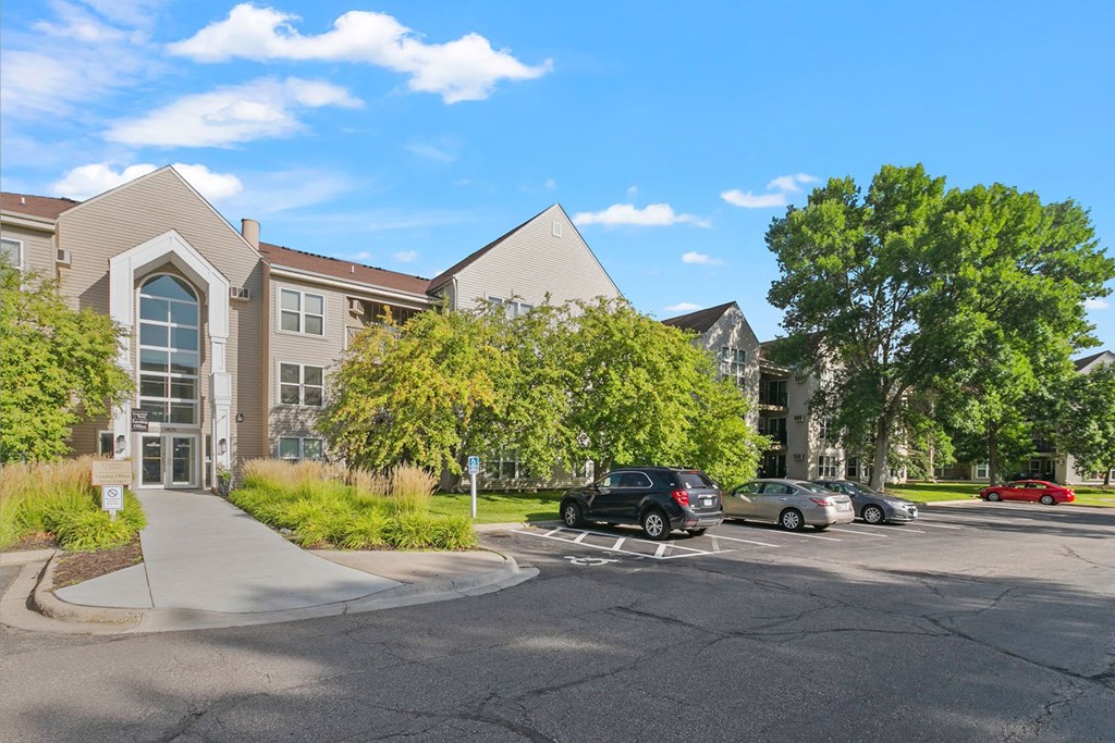 a parking lot with a building in the background