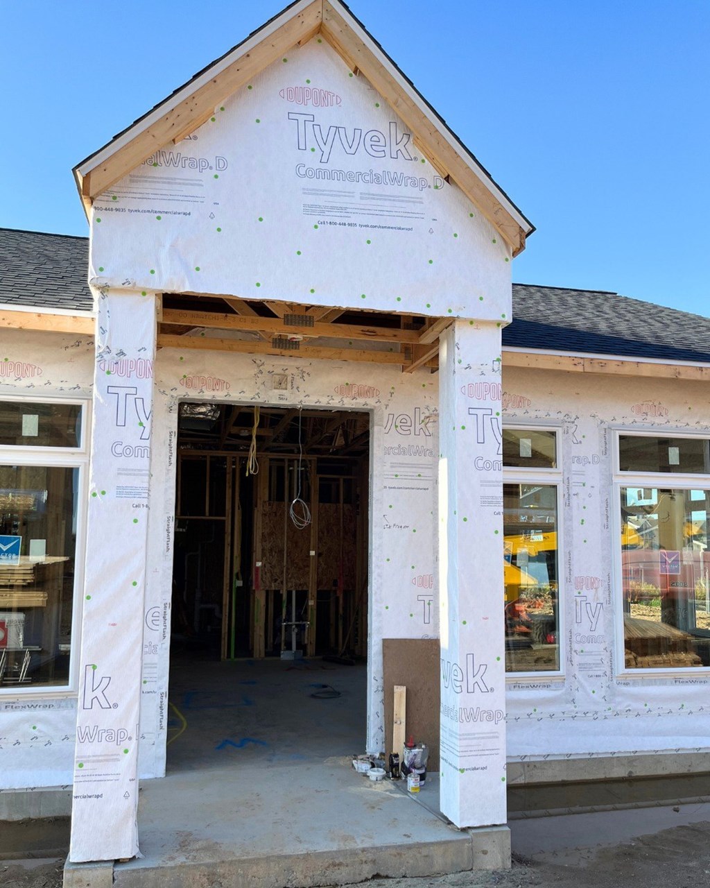 A house under construction with Tyvek branded insulation on the exterior.
