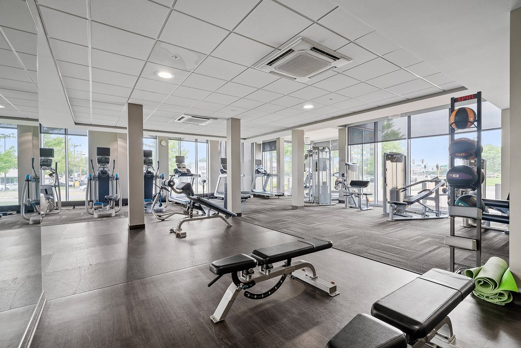 a fitness center with treadmills and other exercise equipment