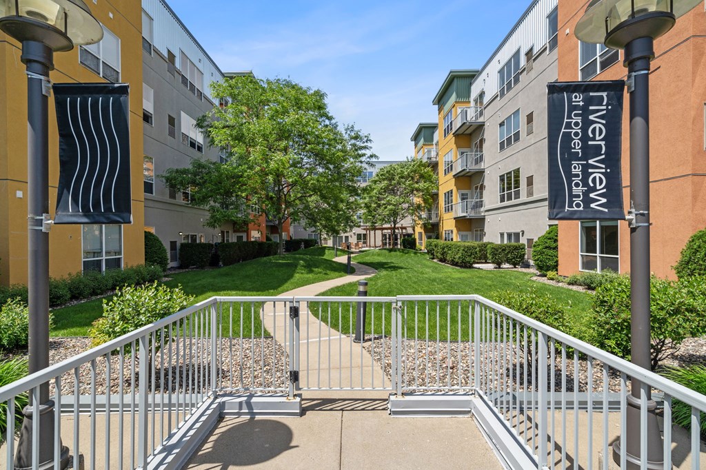 the preserve at city center apartments stairs to entrance with grass and trees