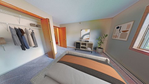 a bedroom with a bed and a closet