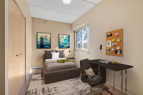 a bedroom with a bed and a desk with a chair