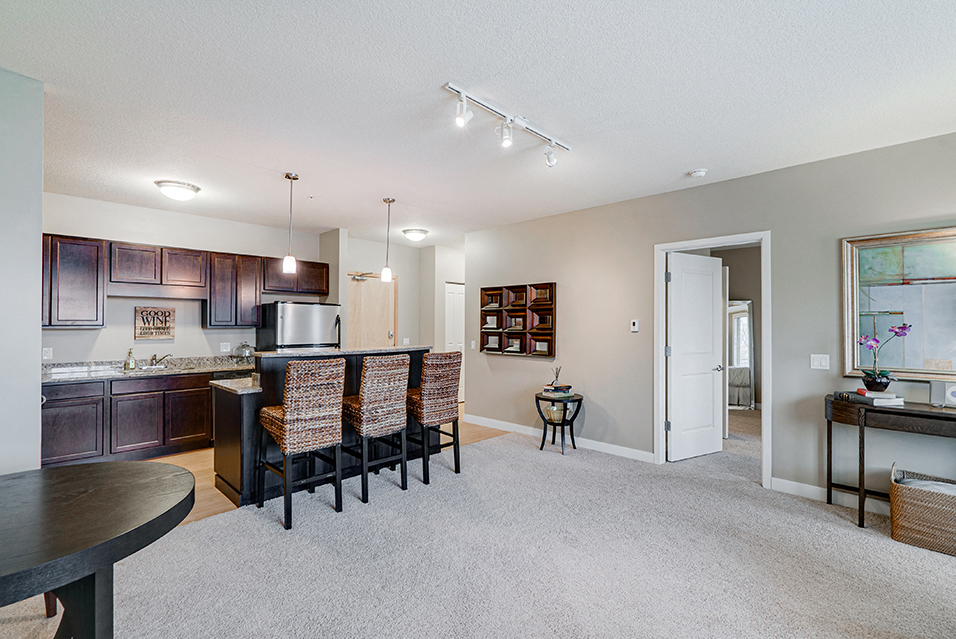 Kitchen  and living room with an open door to the bedroom