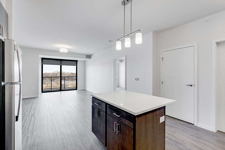 kitchen island and empty living room